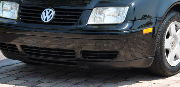 Black Volkswagen Jetta with front bumper