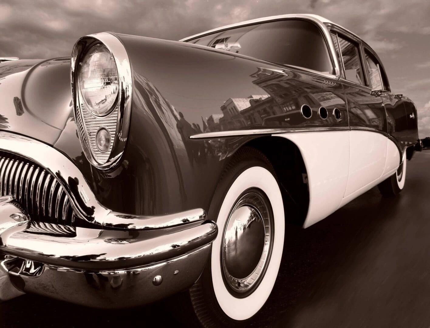 A black and white photo of an old car.
