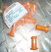 Orange plastic automotive parts in packaging.