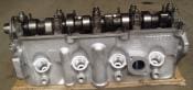 Engine cylinder head with camshaft and valves.