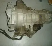 Used car transmission with attached hoses.