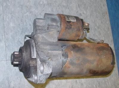 Used car starter motor with damage.