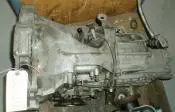 Used car transmission with attached components.