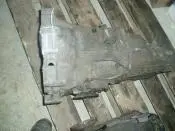 Used car transmission on wooden pallet.