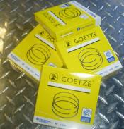 Goetze piston rings in yellow packaging.